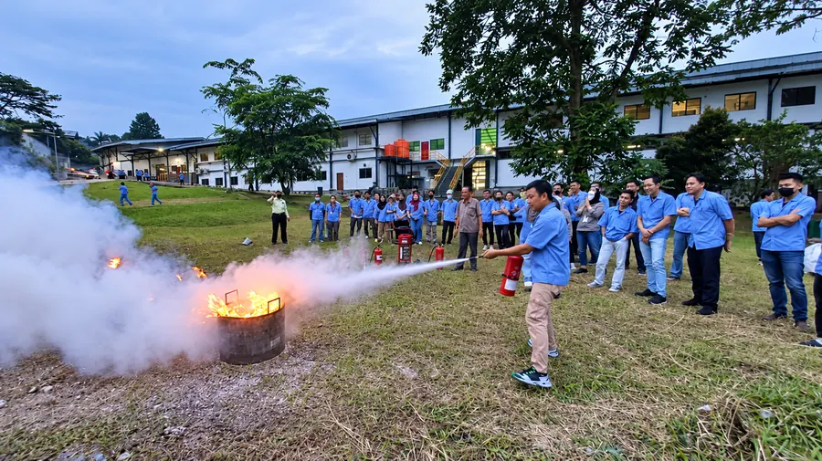 Factory team taking part in fire extinguisher training