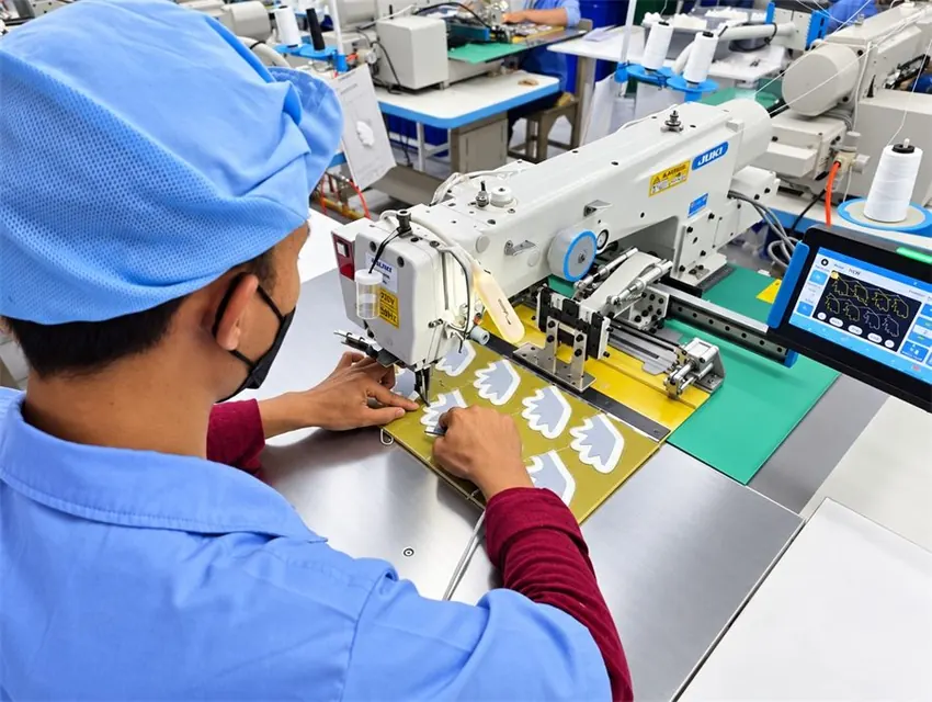 Computerised pattern sewing machine at work